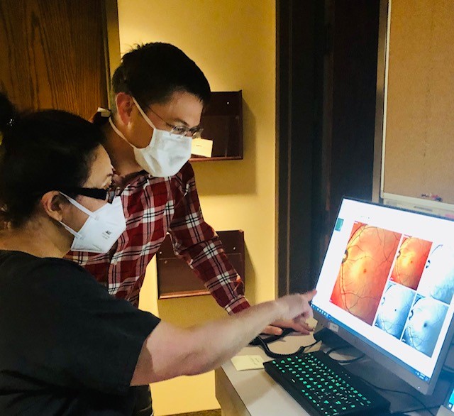 People looking at eye scan